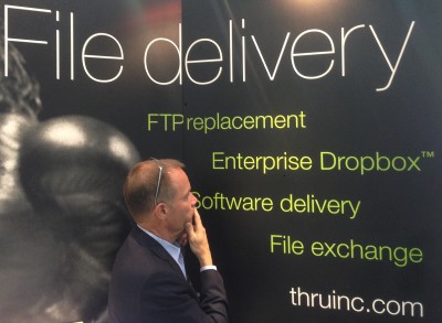 Photo of Lee Harrison in front of Thru banner